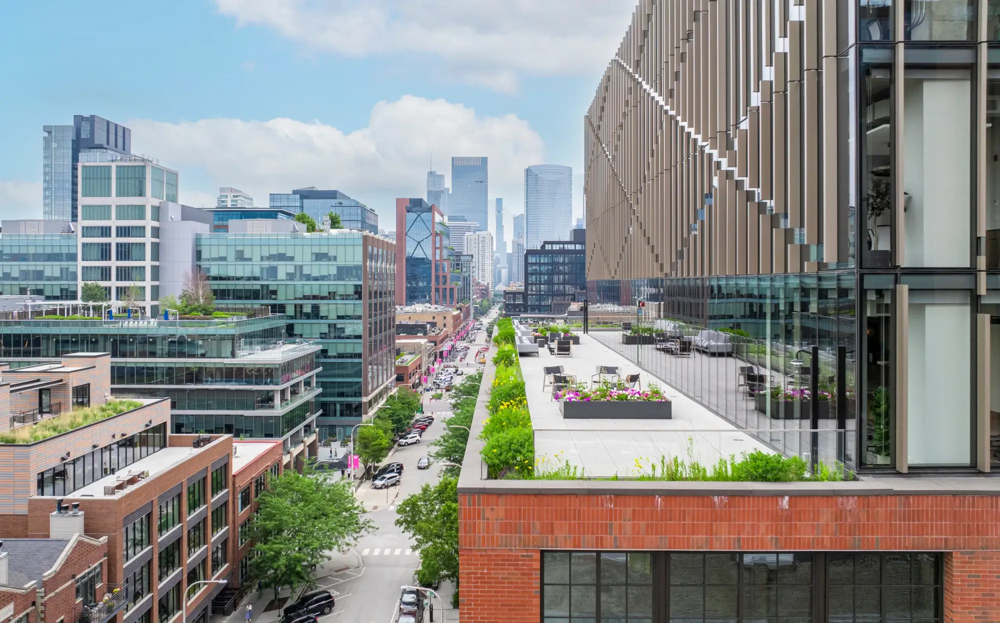 Rooftop terrace with modern seating overlooking downtown Chicago skyline and vibrant cityscape view